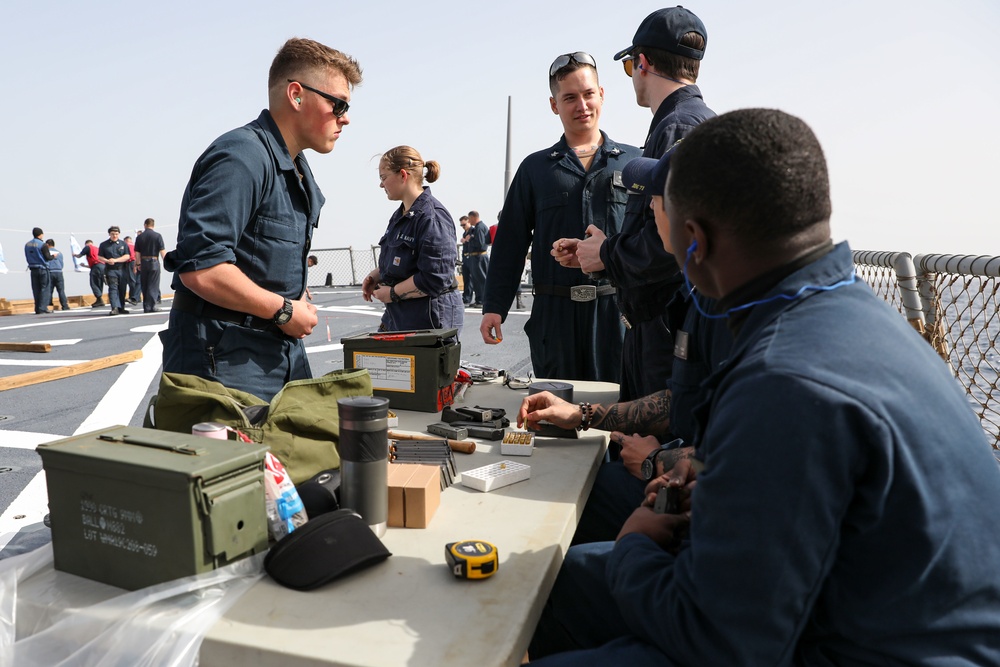Marines aboard USS Ross hold small arms shoot