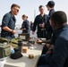 Marines aboard USS Ross hold small arms shoot