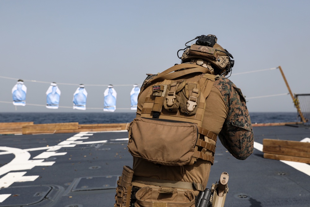 Marines aboard USS Ross hold small arms shoot