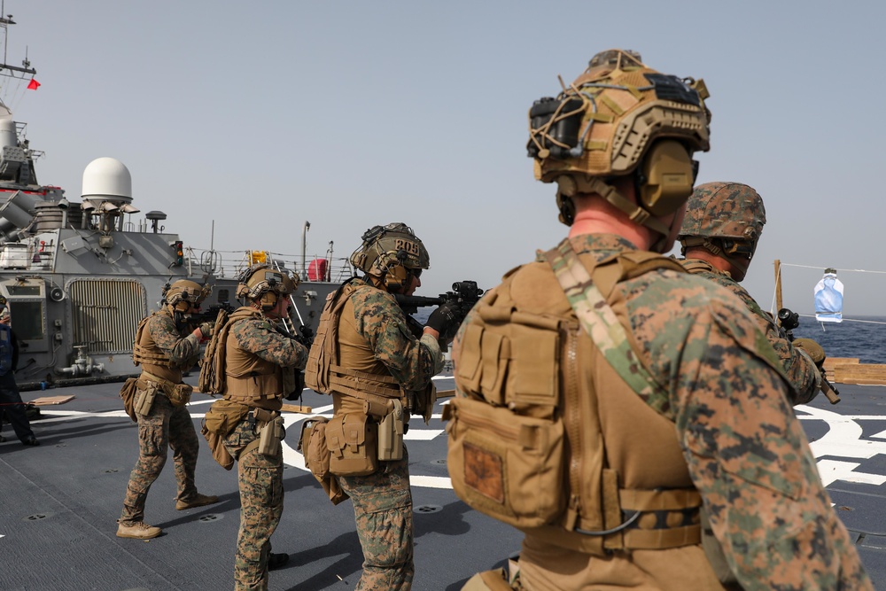 Marines aboard USS Ross hold small arms shoot