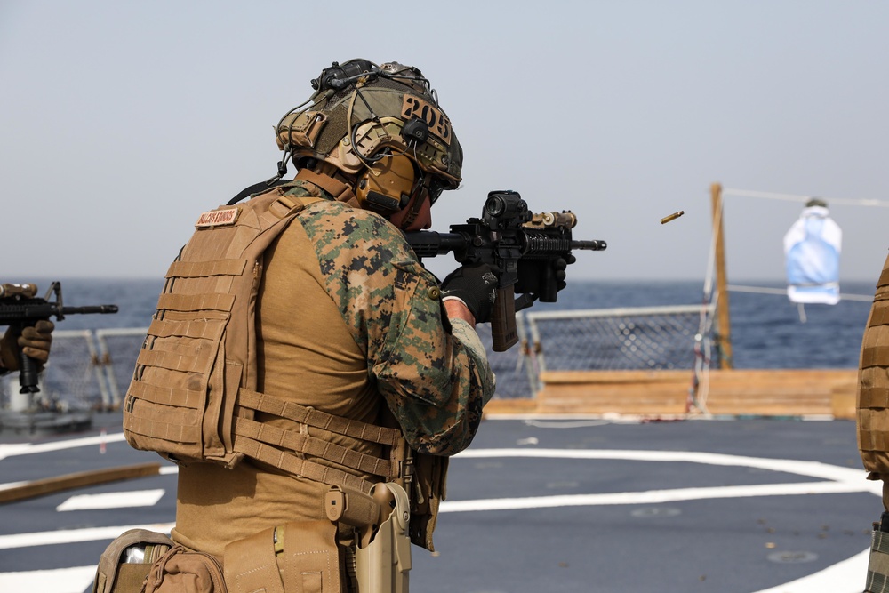 Marines aboard USS Ross hold small arms shoot