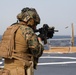 Marines aboard USS Ross hold small arms shoot