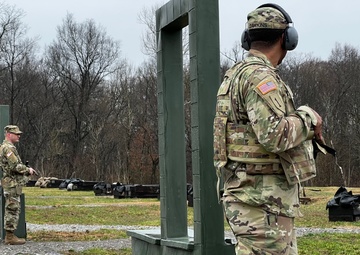 Soldiers of the 135th ESC prepare to execute the M-17 qualification course