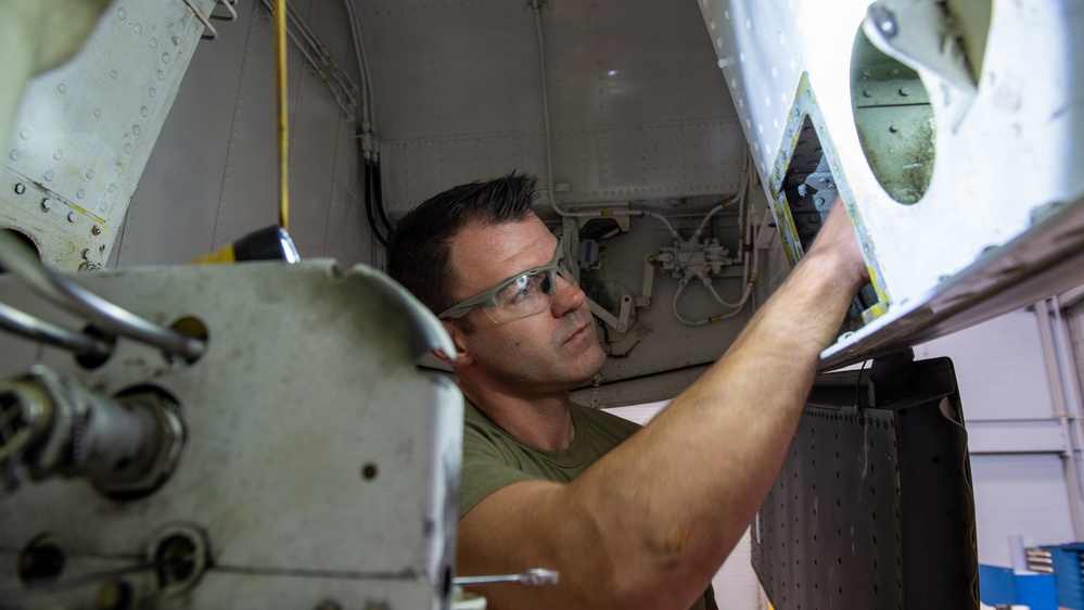 Maintenance Squadron performs a hard landing inspection on tanker