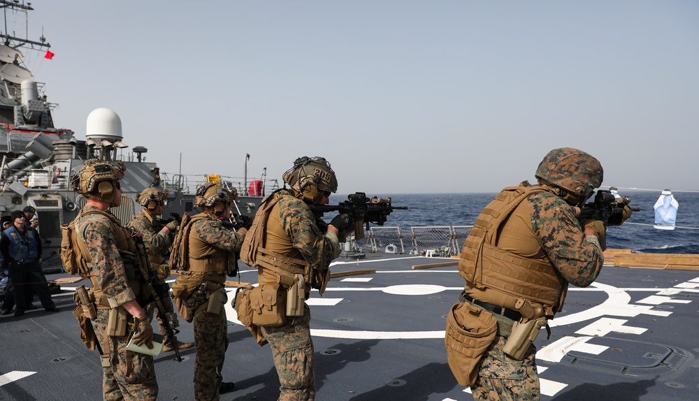 Marines aboard USS Ross hold small arms shoot