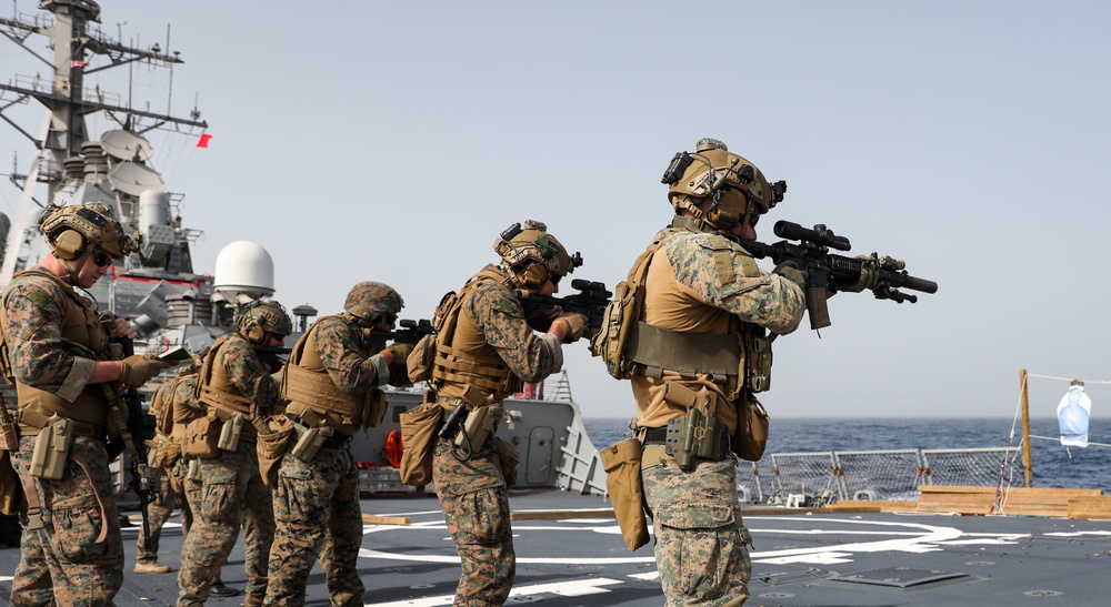 Marines aboard USS Ross hold small arms shoot