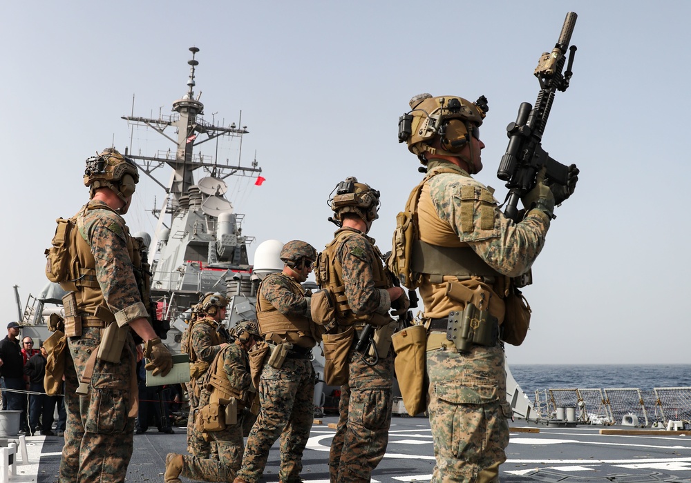 Marines aboard USS Ross hold small arms shoot