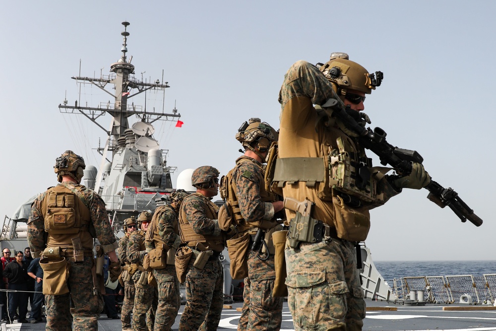Marines aboard USS Ross hold small arms shoot