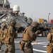 Marines aboard USS Ross hold small arms shoot