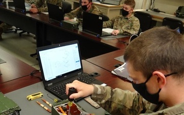 Guard student learns to repair an RT-1523F