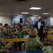 Retired Vice Adm. Charles Martoglio speaks to Sailors aboard the USNS Mercy (T-AH 19)