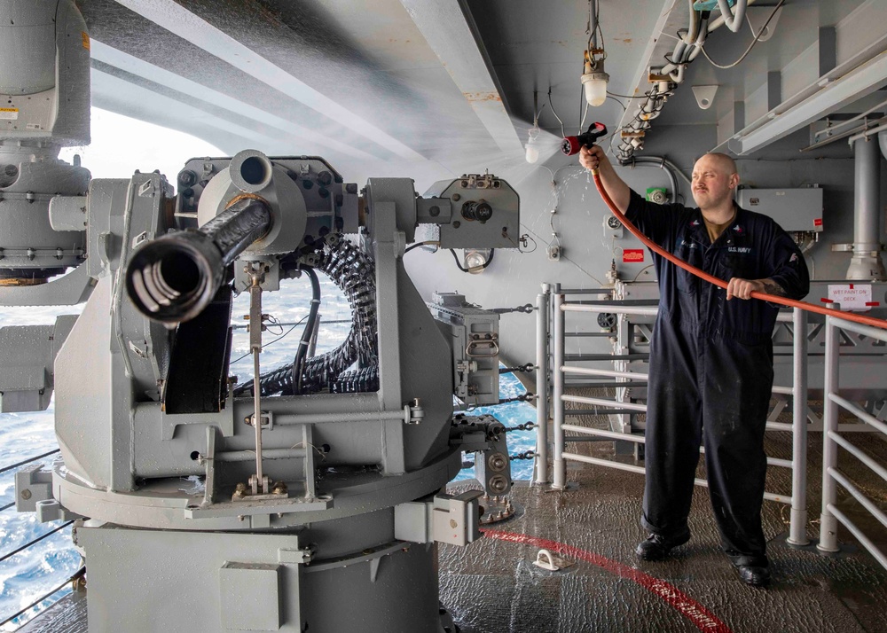 GHWB Sailor Cleans Weapon