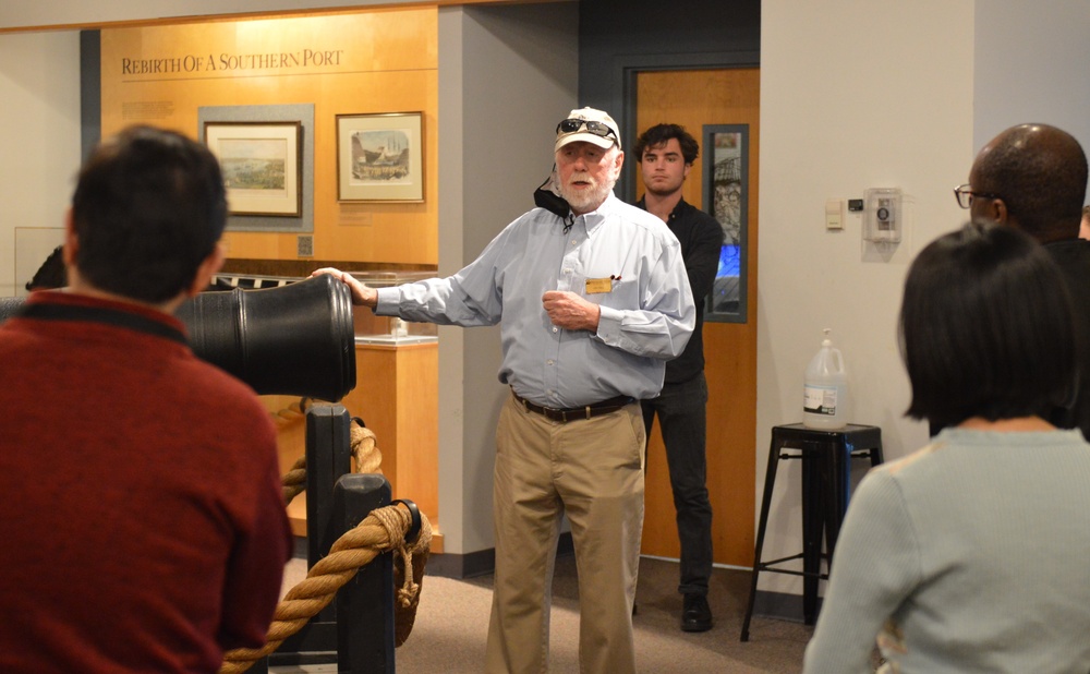 Museum volunteer leads guided tour