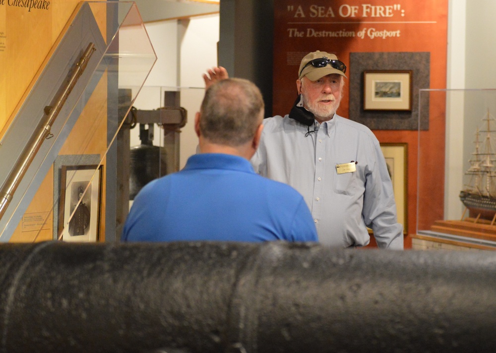 Museum volunteer leads guided tour