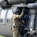 A 12th Aviation Battalion crew chief performs safety checks prior to take off during the JBM-HH functional scale exercise April 13.