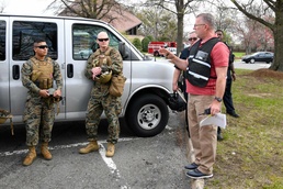 Joint Base Myer-Henderson Hall Chief of Operations Troy Dennison gives Marines a safety brief and reviews the details of the flight prior to take off during the JBM-HH functional scale exercise.