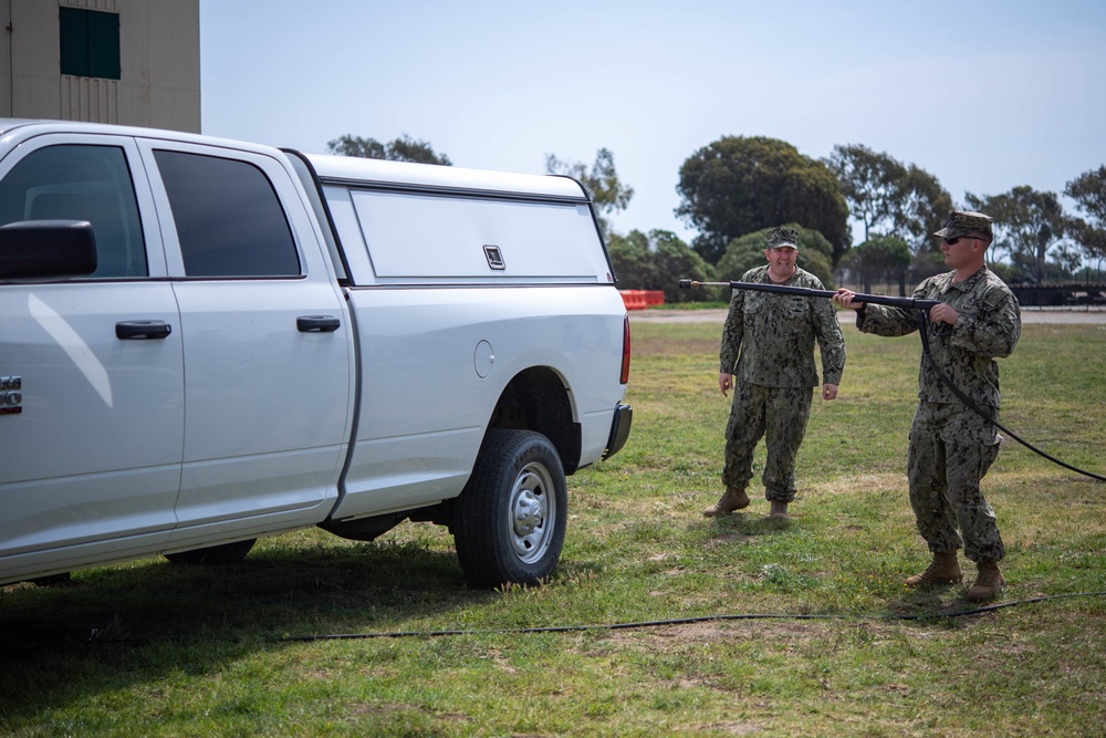 US Navy Seabees with NMCB-5 train on decon of simulated CBR contaminates