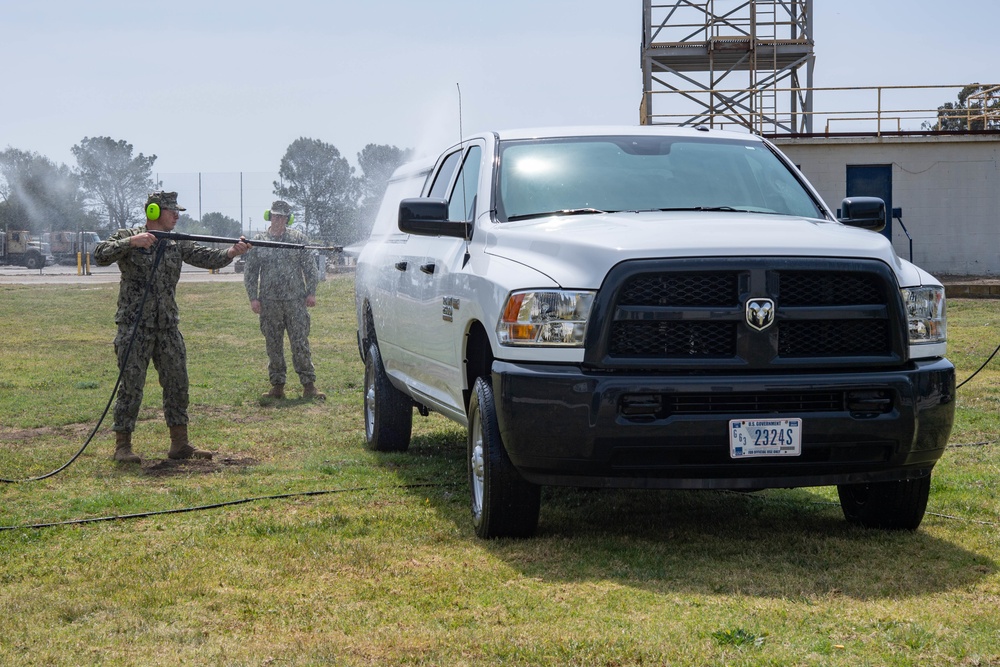 US Navy Seabees with NMCB-5 train on decon of simulated CBR contaminates