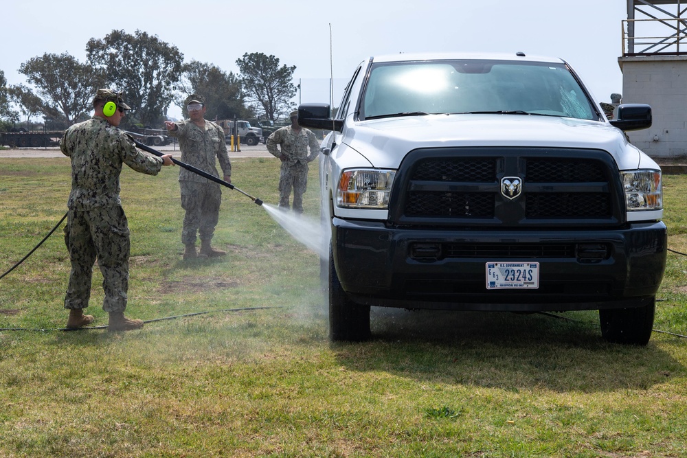 US Navy Seabees with NMCB-5 train on decon of simulated CBR contaminates