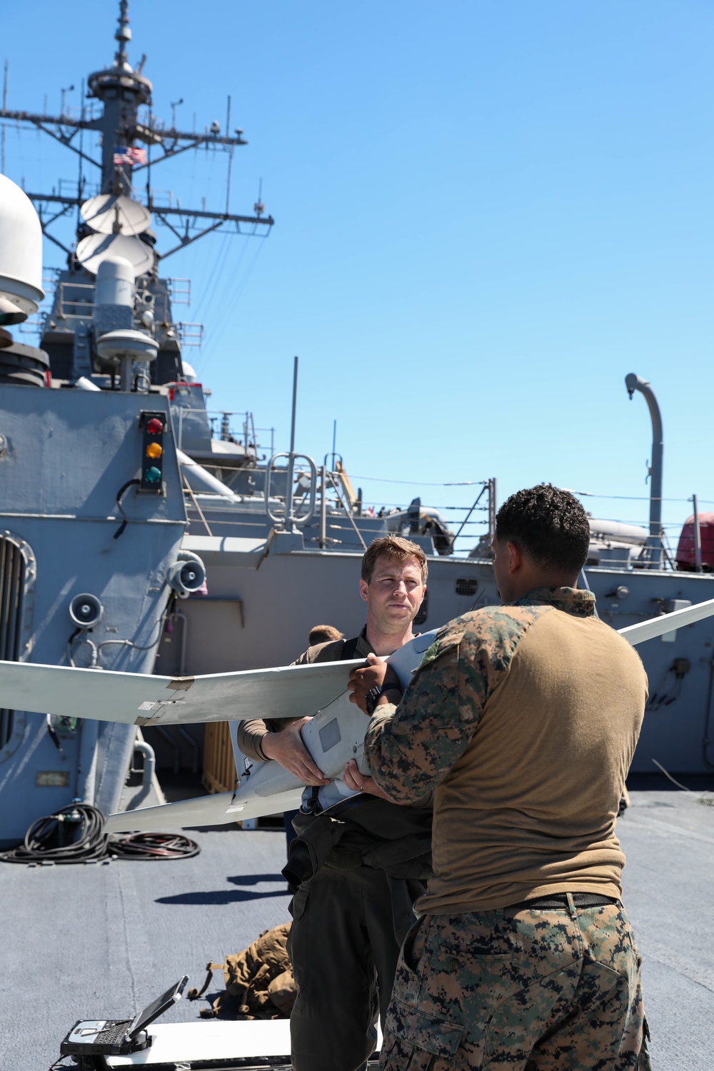 U.S. Marines launch a small unmanned aircraft system from USS Ross