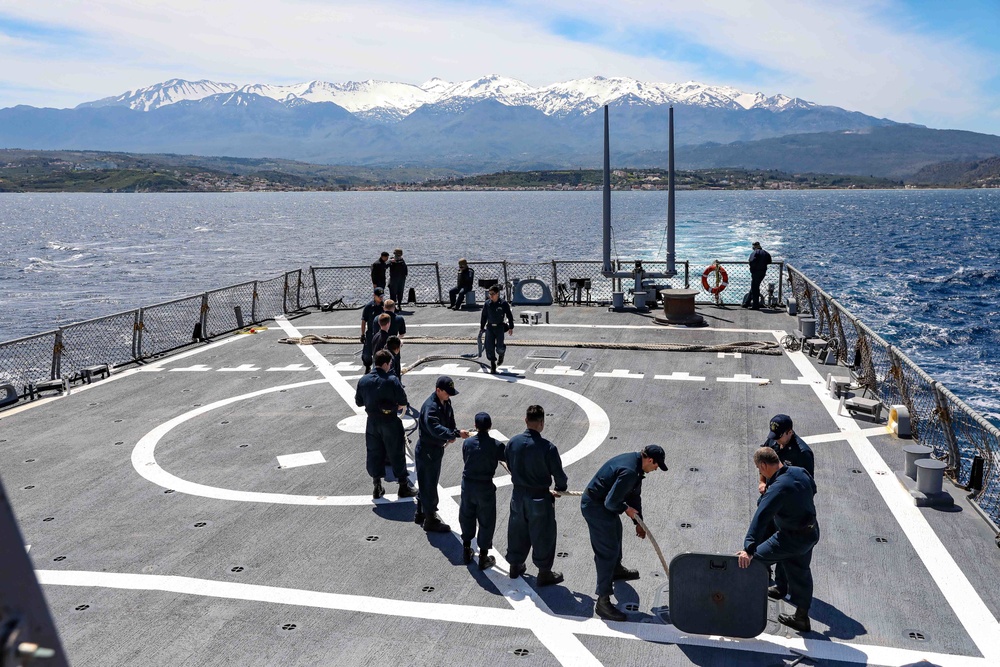 USS Ross leaves port in Souda Bay, Greece
