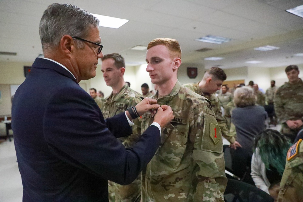 Retired General pins Big Red One Soldier