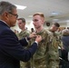 Retired General pins Big Red One Soldier