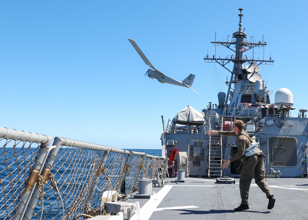 U.S. Marines launch a small unmanned aircraft system from USS Ross