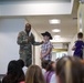 Chaplain Key from the First Infantry Division talks with students about education and childhood goals at Oliver Brown Elementary School in Manhattan, Kansas.