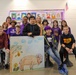 Chaplain Key from the First Infantry Division talks with students about education and childhood goals at Oliver Brown Elementary School in Manhattan, Kansas.