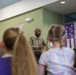 Chaplain Key from the First Infantry Division talks with students about education and childhood goals at Oliver Brown Elementary School in Manhattan, Kansas.