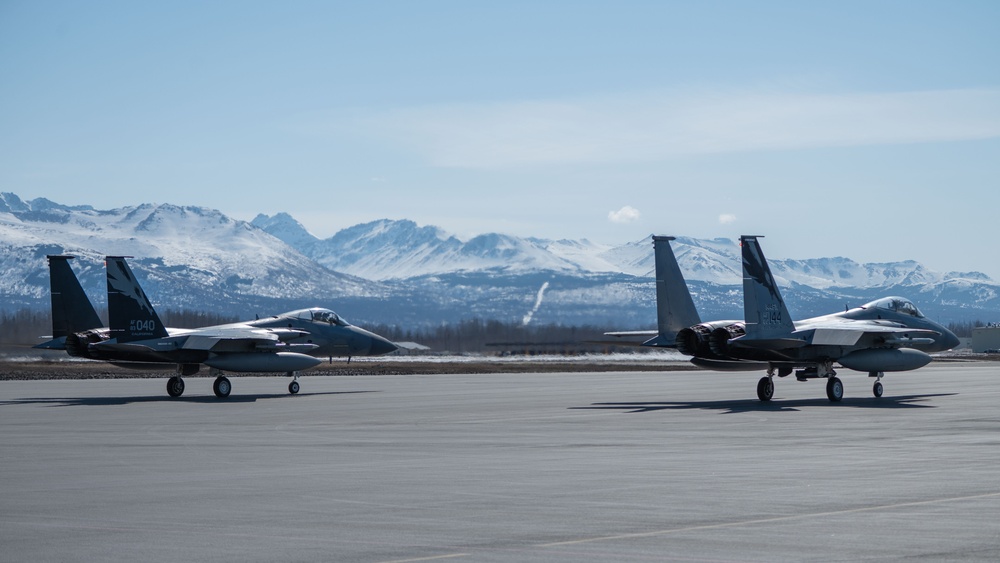 California Air National Guard F-15 Eagles support F-22 Raptors in Alaska