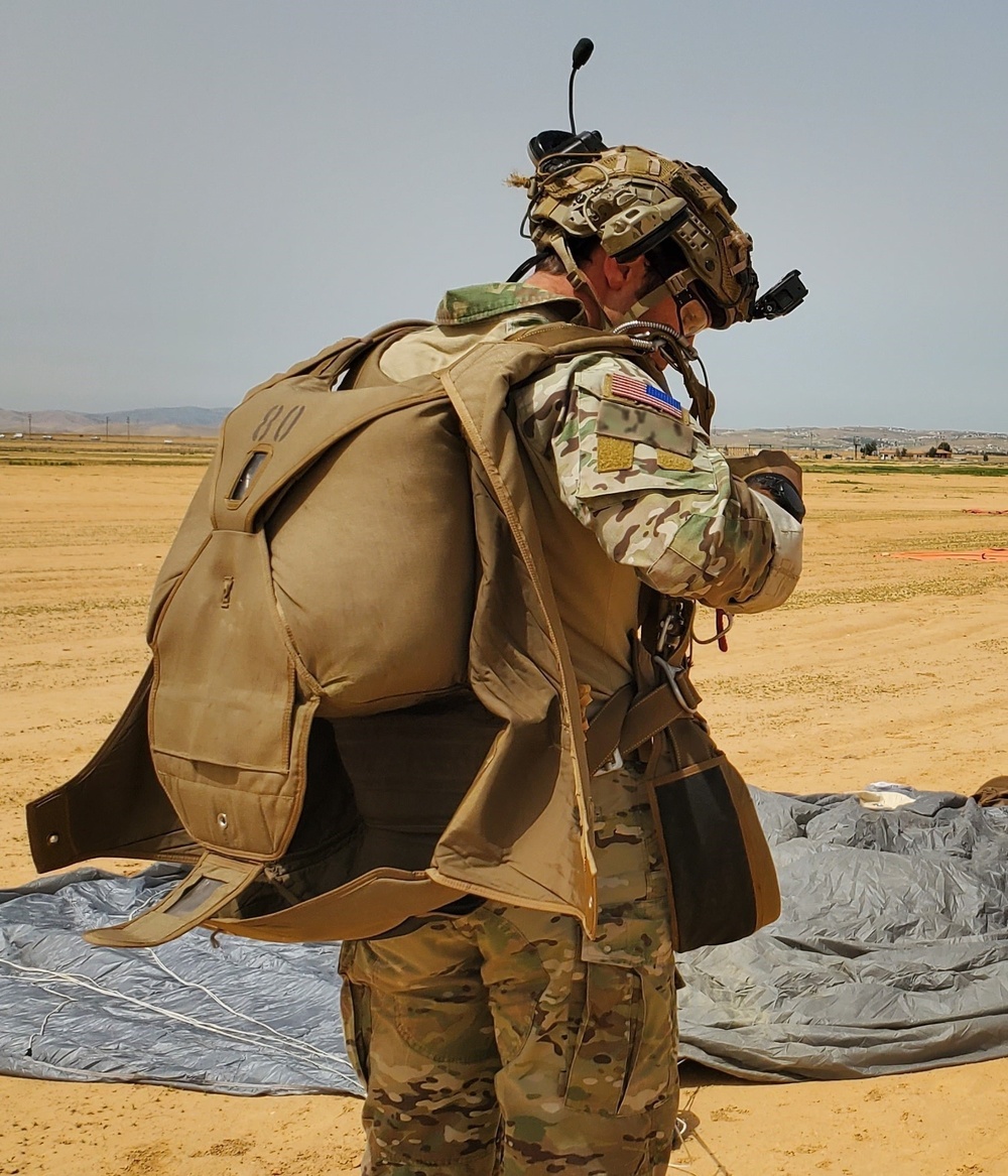 US Special Forces Operator Checks Equipment After a Successful Jump Exercise