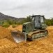NMCB THREE Seabee operates the Caterpillar D6T Dozer to build a berm for the JLTV Operation Course
