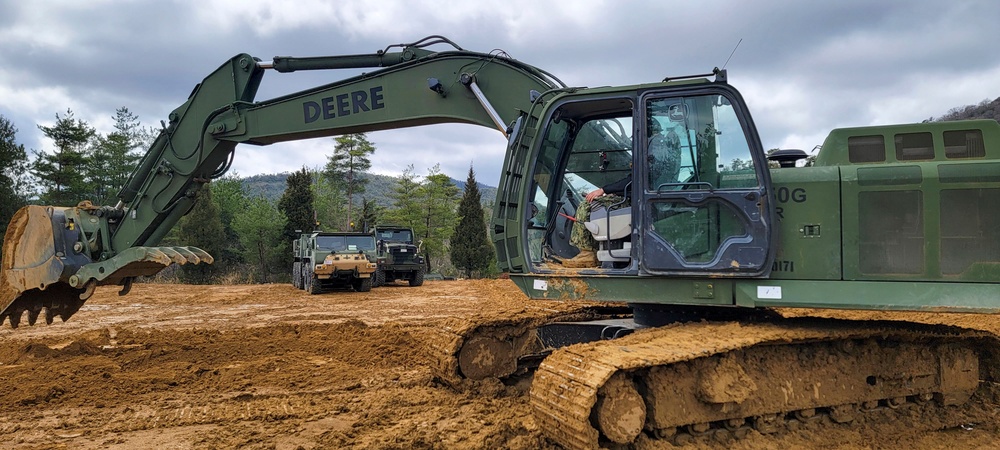 NMCB THREE Seabees takes advantage of training time in the excavator on the JLTV Operation Course