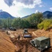 NMCB THREE Seabees utilize bulldozer to remove a Humvee from the mud on board MCAS Iwakuni