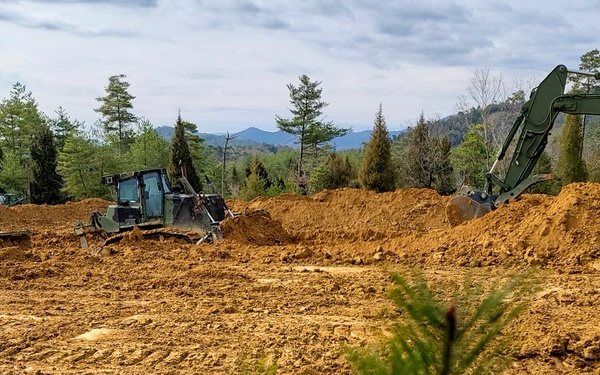 NMCB 3 Seabees work alongside MWSS 171 to create the Joint Light Tactical Vehicle training course onboard MCAS Iwakuni.