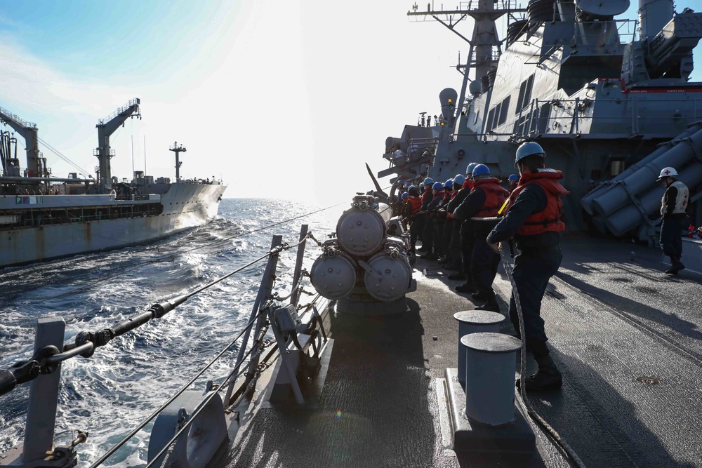 USS Ross replenishes at sea with USNS Laramie