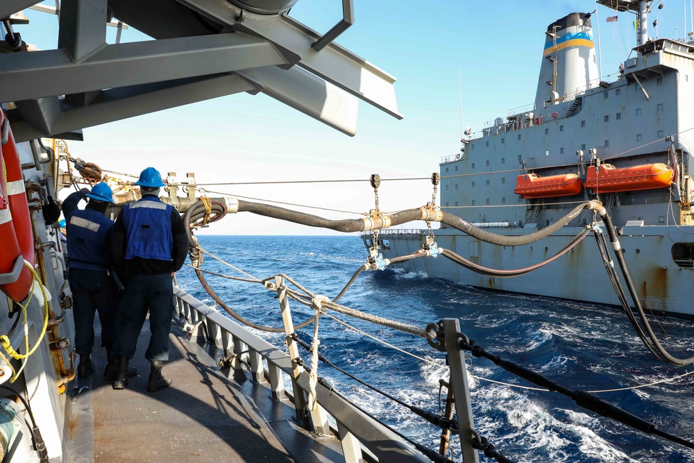 USS Ross replenishes at sea with USNS Laramie