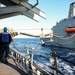 USS Ross replenishes at sea with USNS Laramie