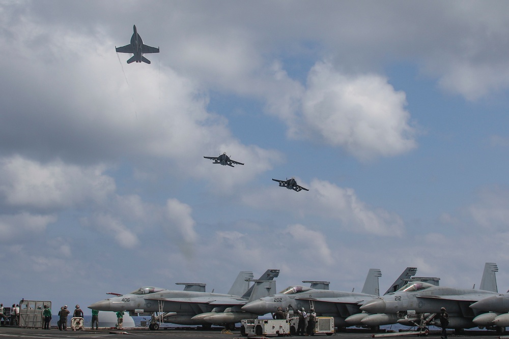 Abraham Lincoln holds an in-flight change of command ceremony for VFA-14