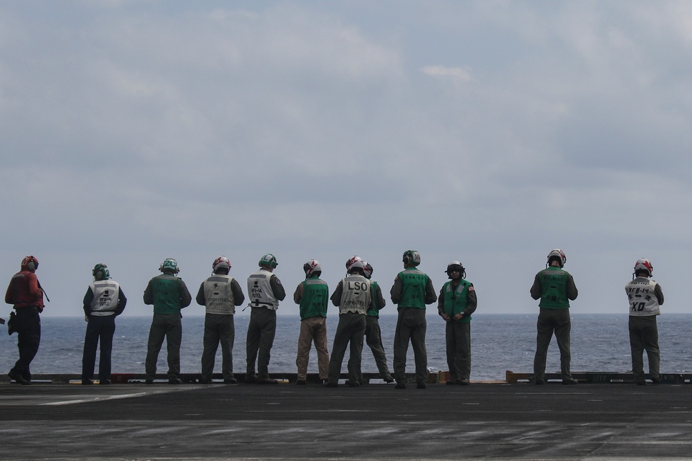 Abraham Lincoln holds an in-flight change of command ceremony for VFA-14