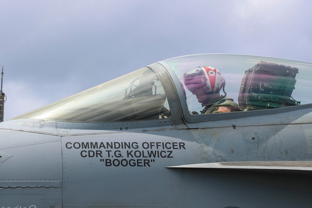 Abraham Lincoln holds an in-flight change of command ceremony for VFA-14