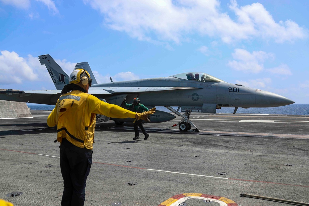 Abraham Lincoln holds an in-flight change of command ceremony for VFA-14