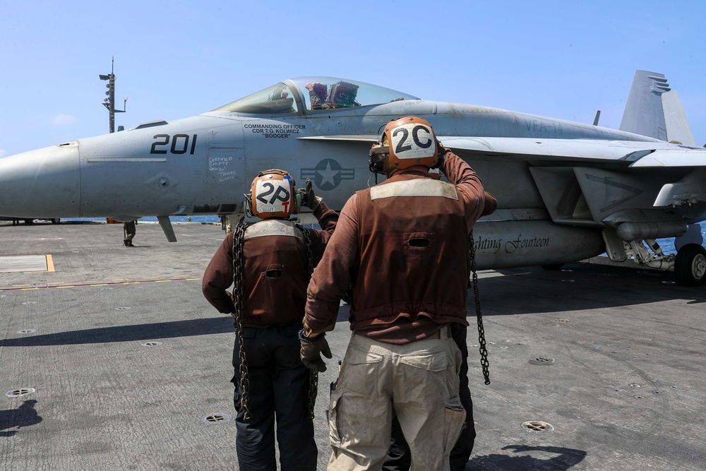 Abraham Lincoln holds an in-flight change of command ceremony for VFA-14