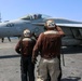 Abraham Lincoln holds an in-flight change of command ceremony for VFA-14