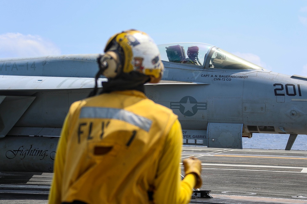 Abraham Lincoln holds an in-flight change of command ceremony for VFA-14