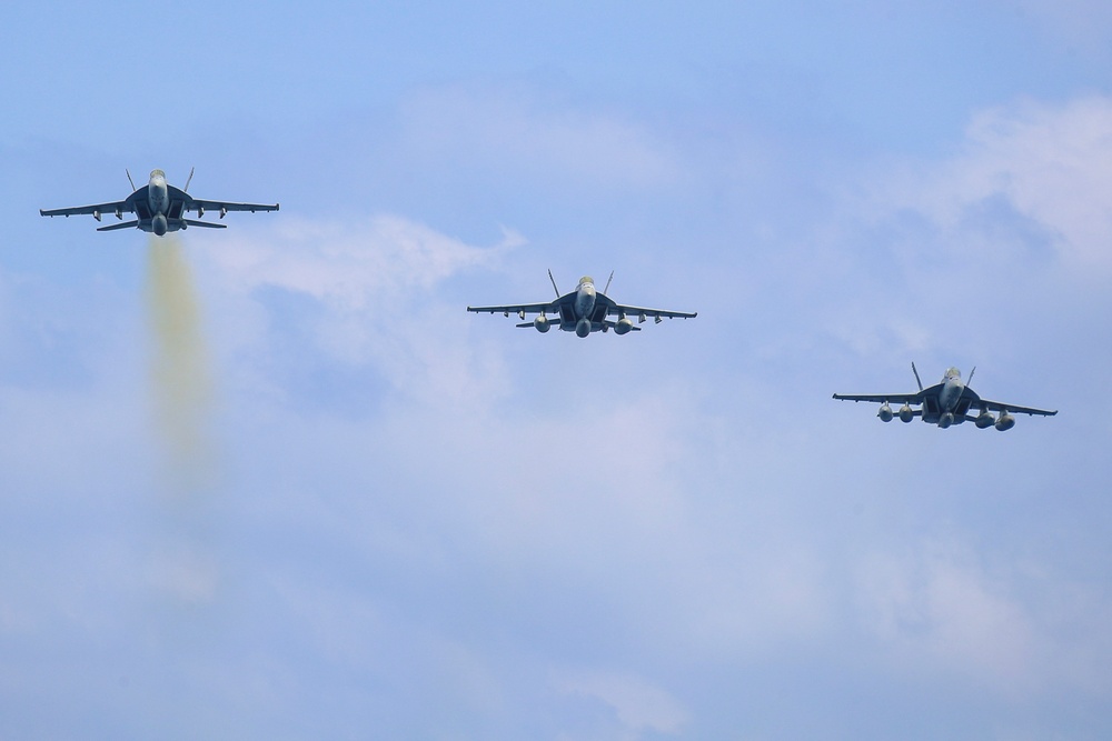 Abraham Lincoln holds an in-flight change of command ceremony for VFA-14