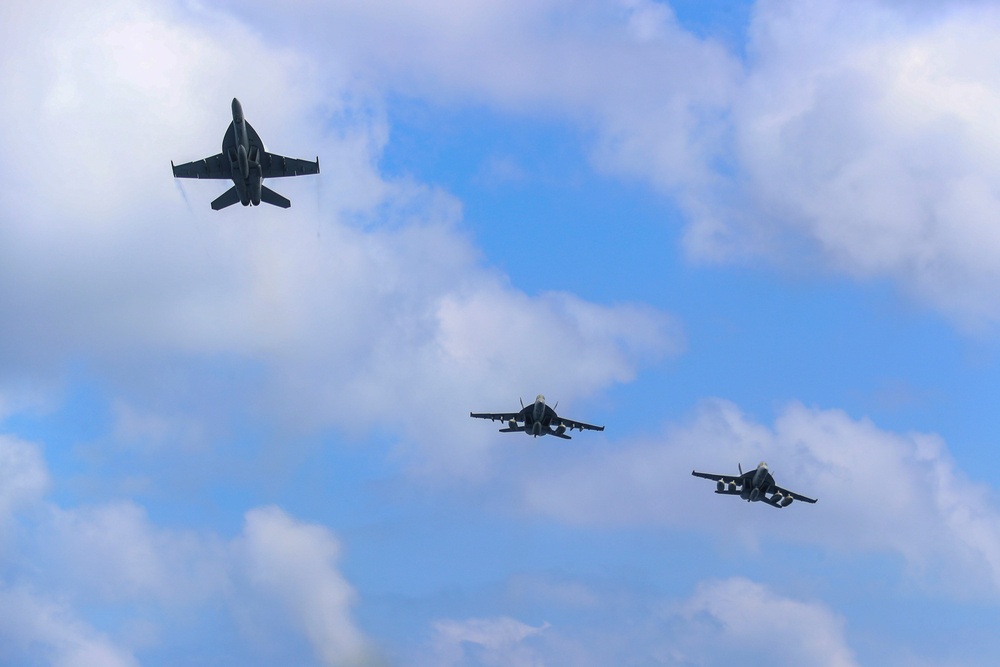 Abraham Lincoln holds an in-flight change of command ceremony for VFA-14