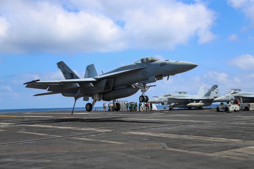 Abraham Lincoln holds an in-flight change of command ceremony for VFA-14